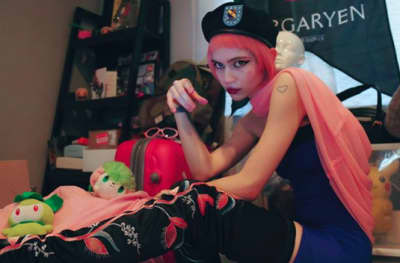 Grimes says “no music any time soon,” blames “trash music industry”