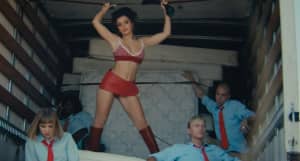 Charli XCX turns mattress saleswoman in the “Hot In It” video