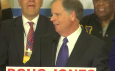 Watch Doug Jones walk off stage to “Teach Me How To Dougie” after win in Alabama