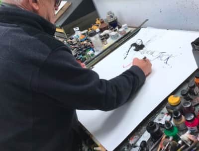 Travis Scott and Quavo appear to share album cover art, created by Ralph Steadman