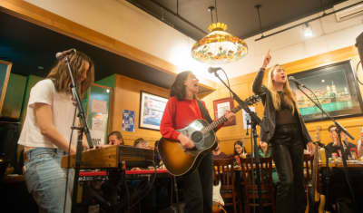 Watch HAIM’s immaculate, New York deli cover of Britney Spears’s “I’m Not A Girl, Not Yet A Woman”