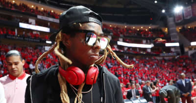 Lil Wayne hit with federal weapons charge for boarding a plane with a gold-plated handgun