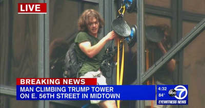 A Man Is Climbing Trump Tower In New York City Using Suction Cups