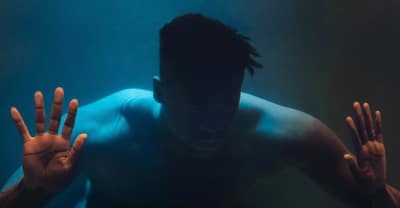 Moses Sumney Is Submerged In Water In His “Doomed” Video