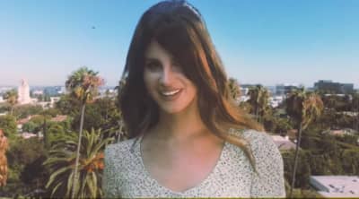 Lana Del Rey is the tallest woman on Earth in her new “Doin’ Time” video