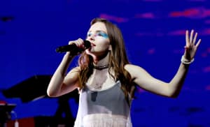 CHVRCHES’ Lauren Mayberry says she’s “investing in bulletproof tutus” after receiving death threats from Chris Brown fans