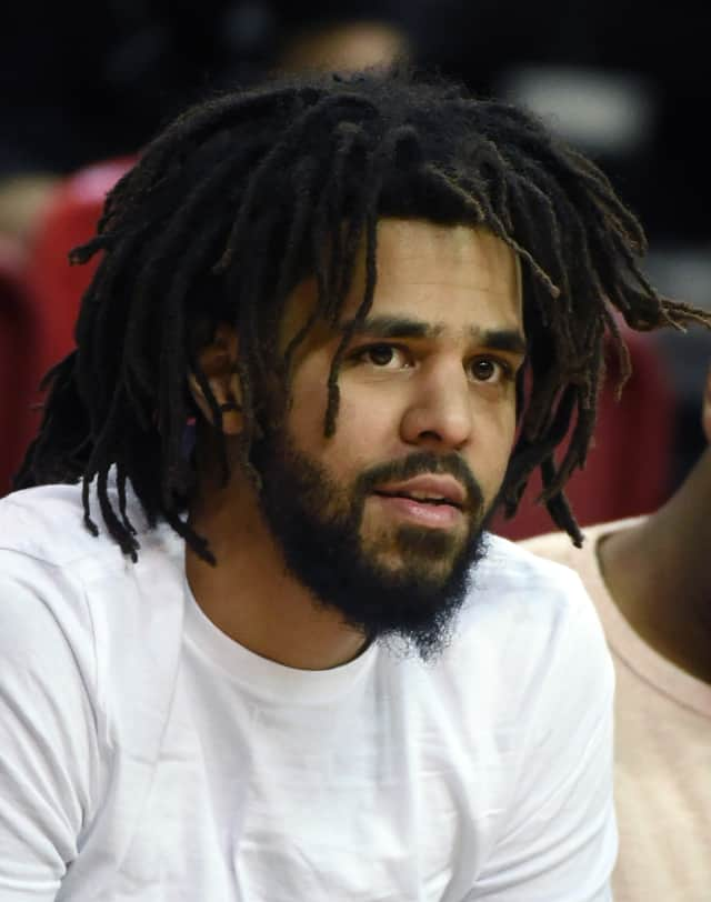 Man with black beard, J. Cole Holding Face, music stars, j. cole