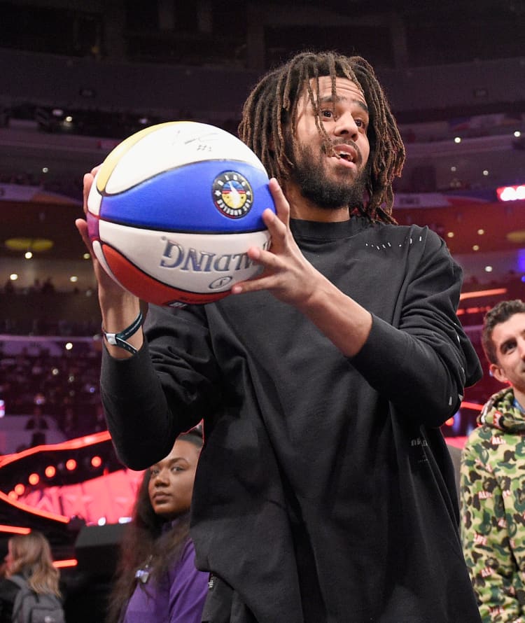 J COLE 15 PATRIOTS VISIT RWANDA BASKETBALL JERSEY