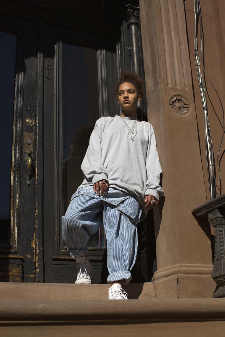 https://thefader-res.cloudinary.com/private_images/w_760%2Cc_limit%2Cf_auto%2Cq_auto%3Aeco/BrownstoneOveralls3_RAW_otpze0/overalls-oshkosh-sweatshirt-nike-shoes-converse-necklace-lady-grey.jpg
