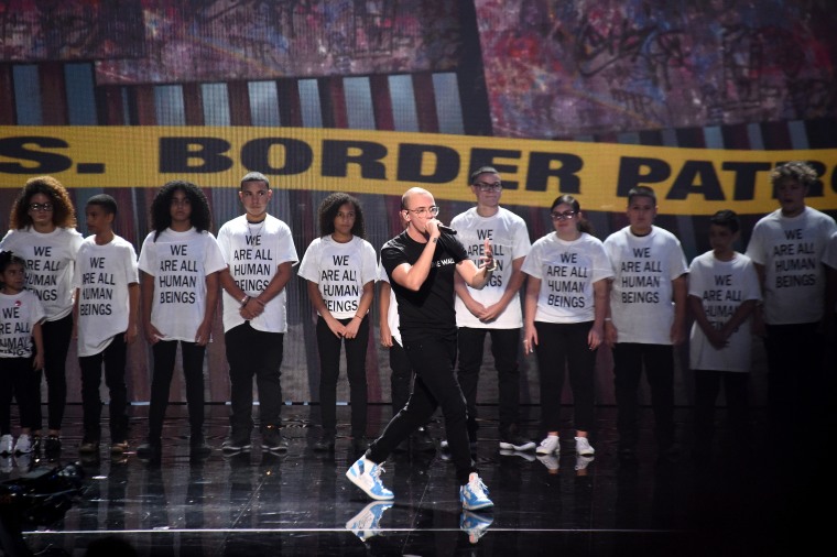 Watch Logic and Ryan Tedder give a heartwarming performance for “One Day” at the VMAs