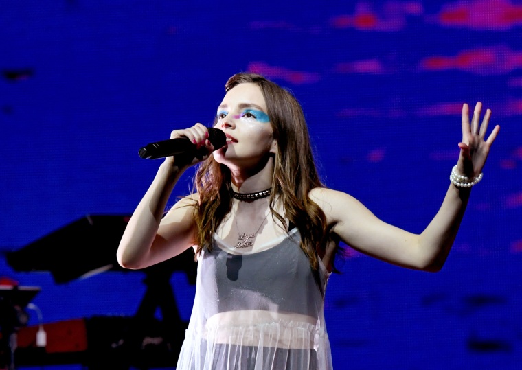 CHVRCHES’ Lauren Mayberry says she’s “investing in bulletproof tutus” after receiving death threats from Chris Brown fans