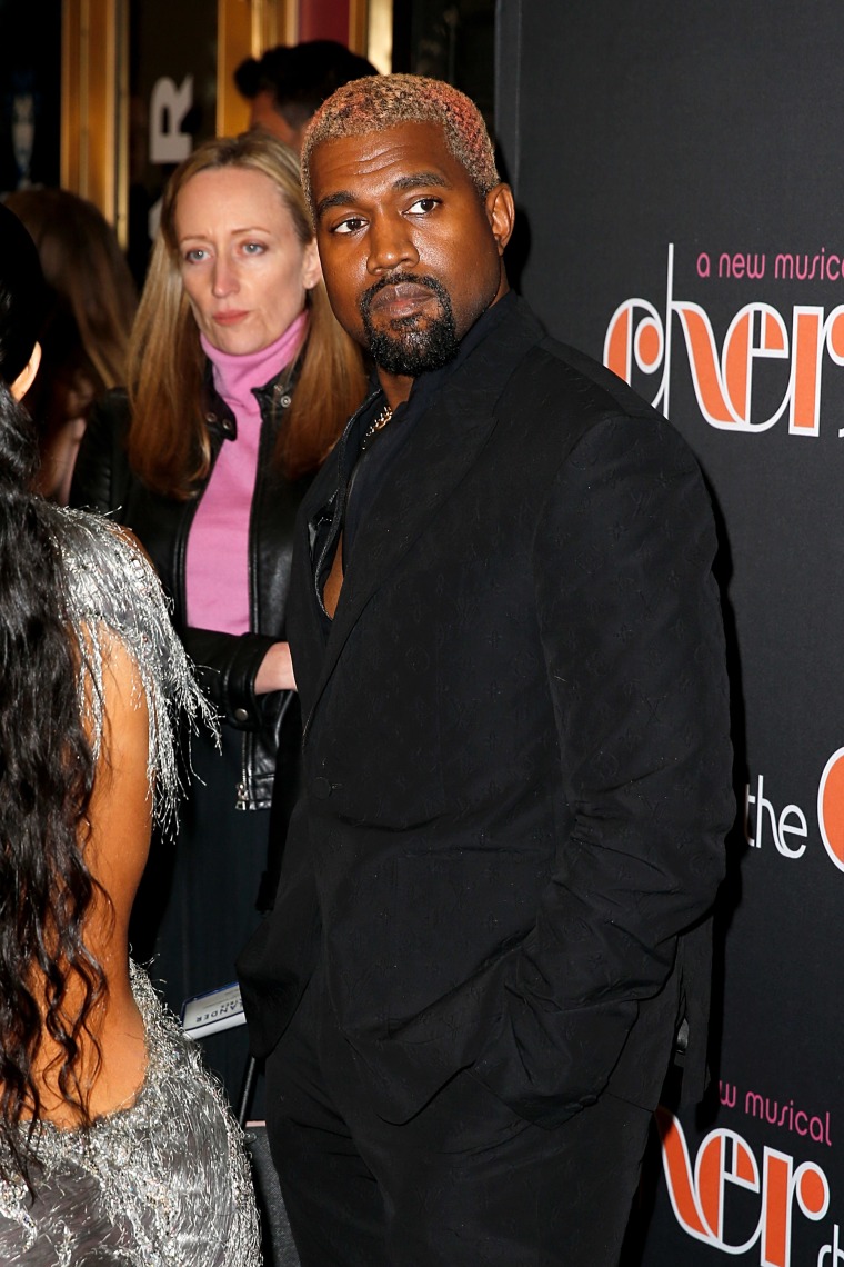 Kanye West apologized after being caught on his phone during the Cher musical