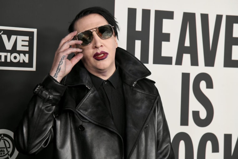 Police investigating Marilyn Manson domestic abuse claims search his LA home