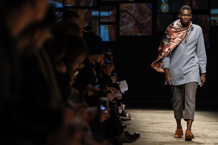 African Models Seeking Asylum In Europe Walk At Pitti Uomo