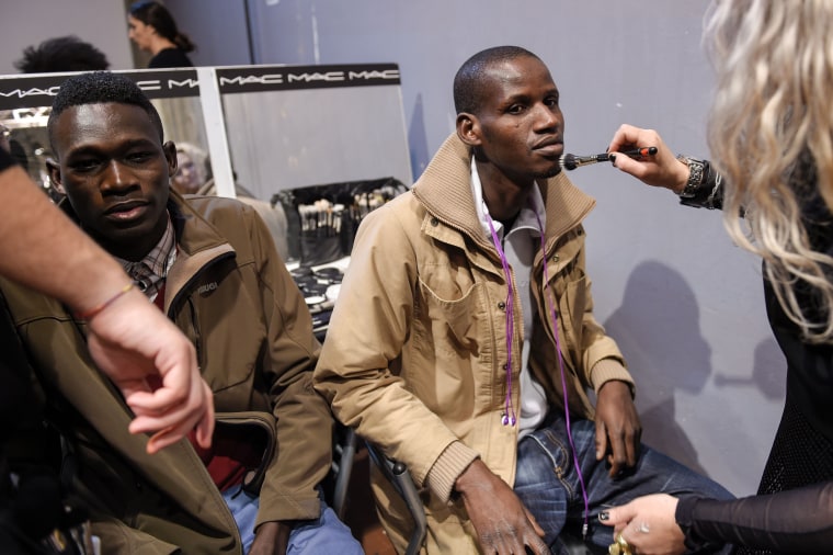 African Models Seeking Asylum In Europe Walk At Pitti Uomo