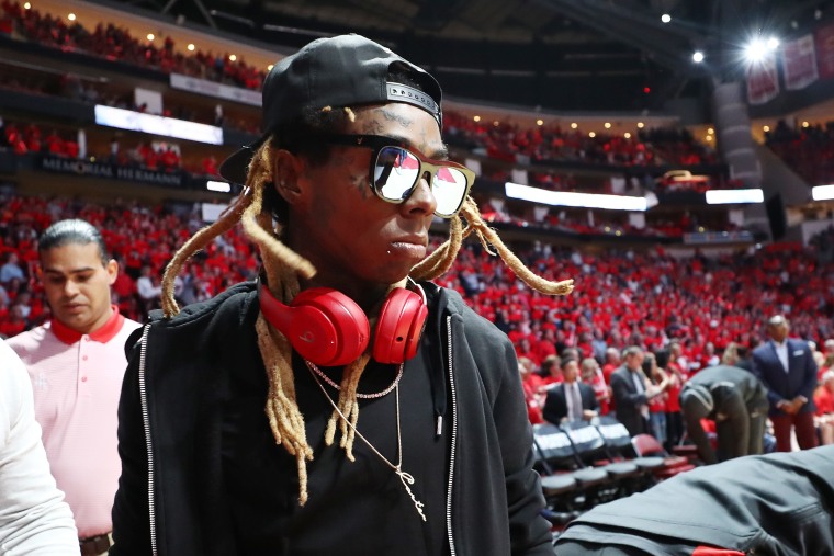 Lil Wayne hit with federal weapons charge for boarding a plane with a gold-plated handgun